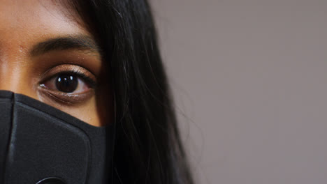 Pull-Focus-Close-Up-of-Woman-Wearing-Face-Mask-