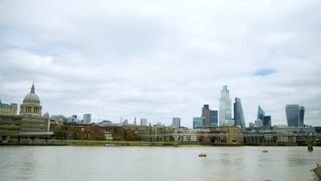 london thames with st paul's cathedral and other skyscrapers in the background central london time-lapse