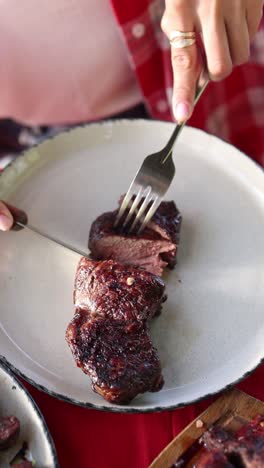 Woman Eating Grilled Steak
