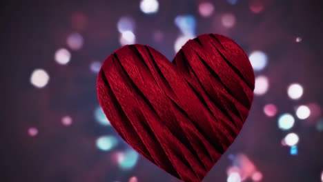 red textured heart on bokeh background