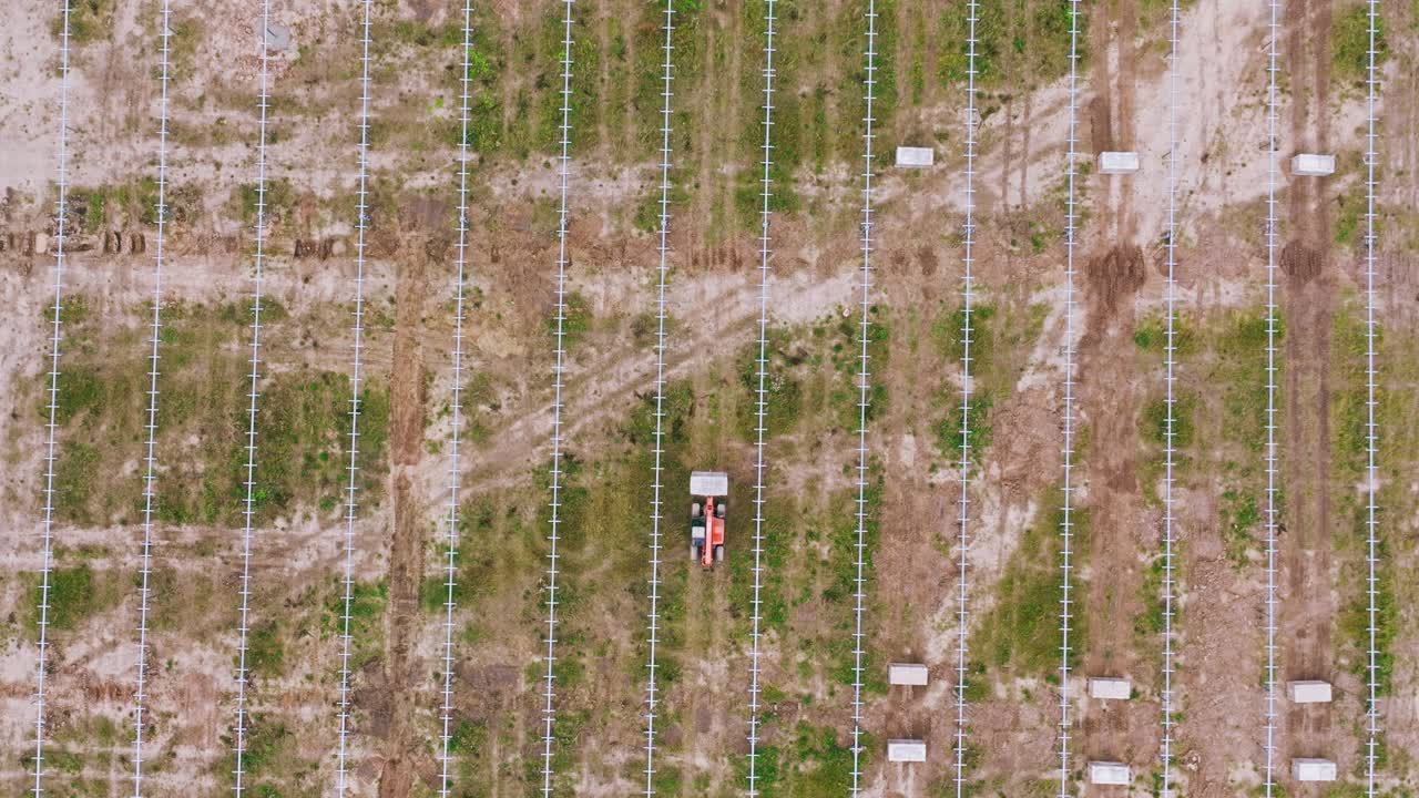 Aerial cinematic shot of renewable energy infrastructure, solar farm in Latvia