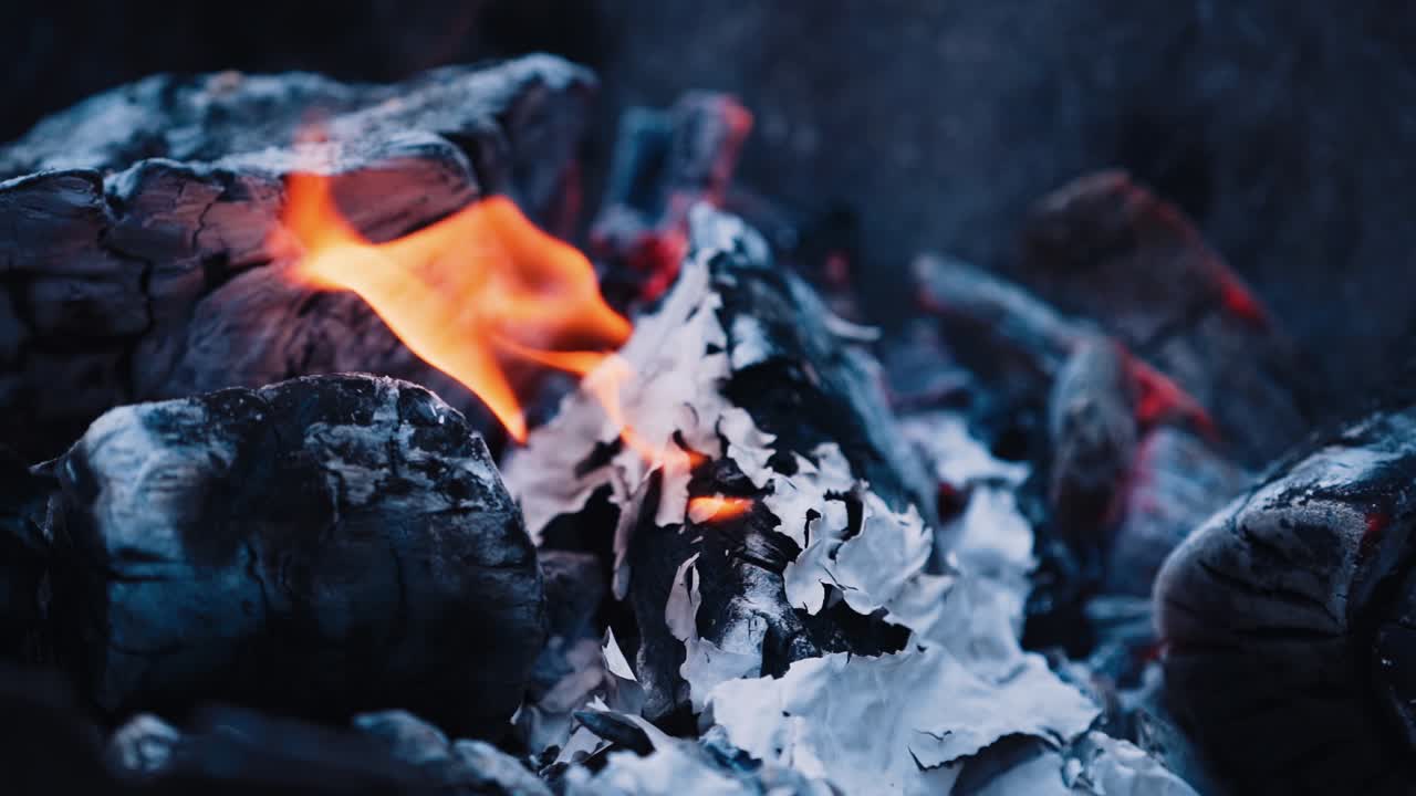 Flame when burning the paper in the bonfire