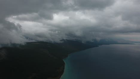 aerial drone shot slow timelapse stationary over cloudy lake in mongolia