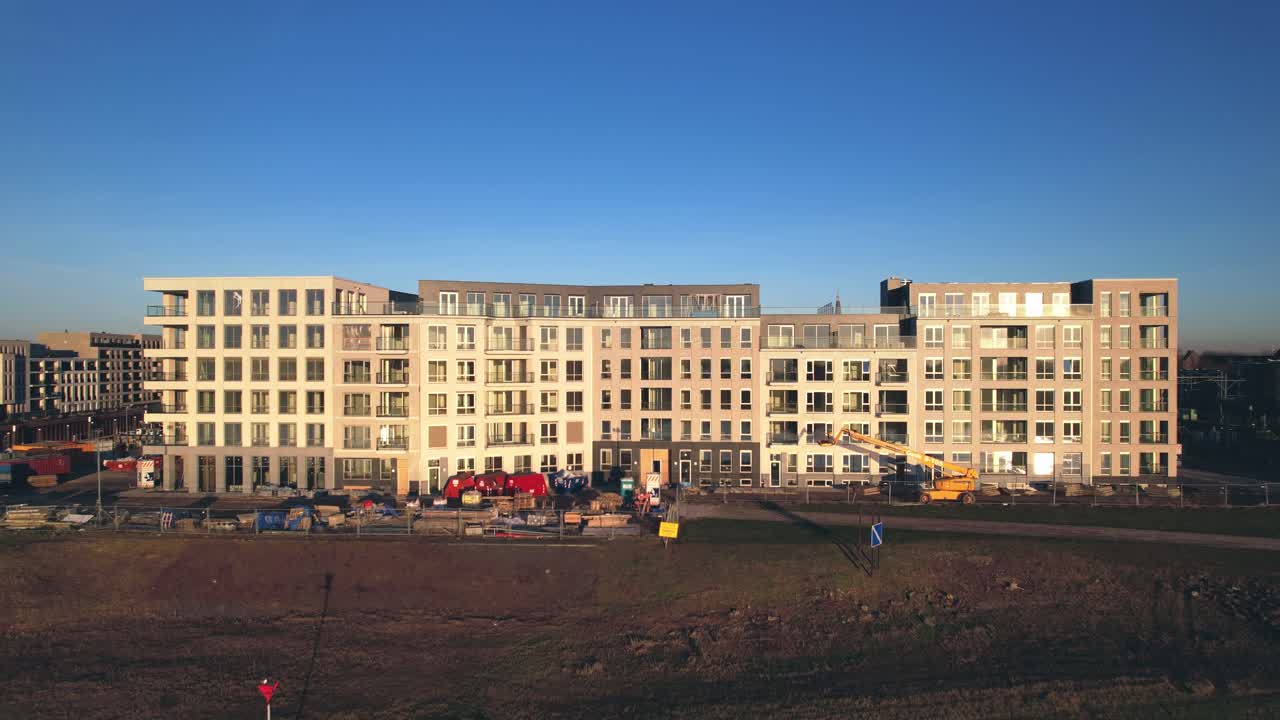 Meadow floodplains and aerial view on Kade Zuid new housing construction project part of urban development in Zutphen with Noorderhaven neighbourhood along river IJssel