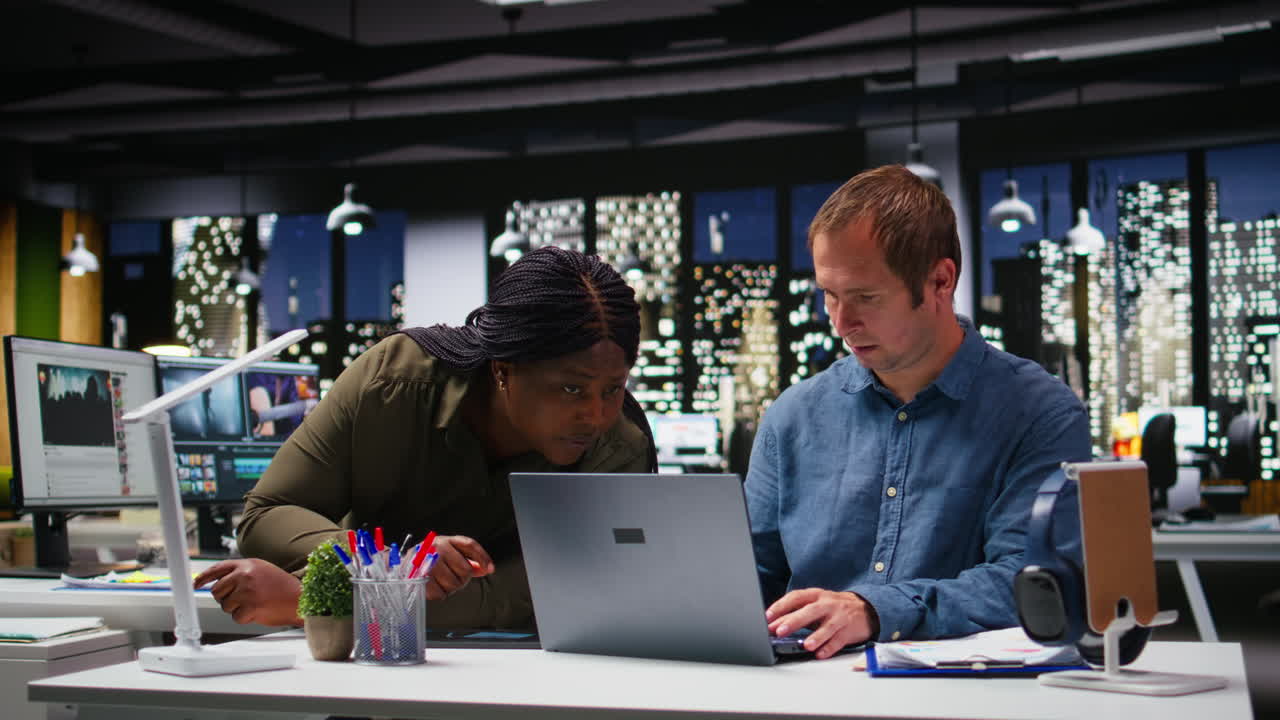 Multiethnic business workers projecting numbers for market research