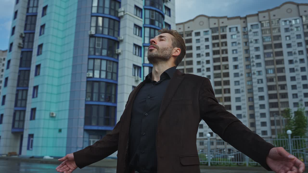 Man in urban setting, feeling peaceful and hopeful
