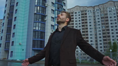 man in urban setting, feeling peaceful and hopeful