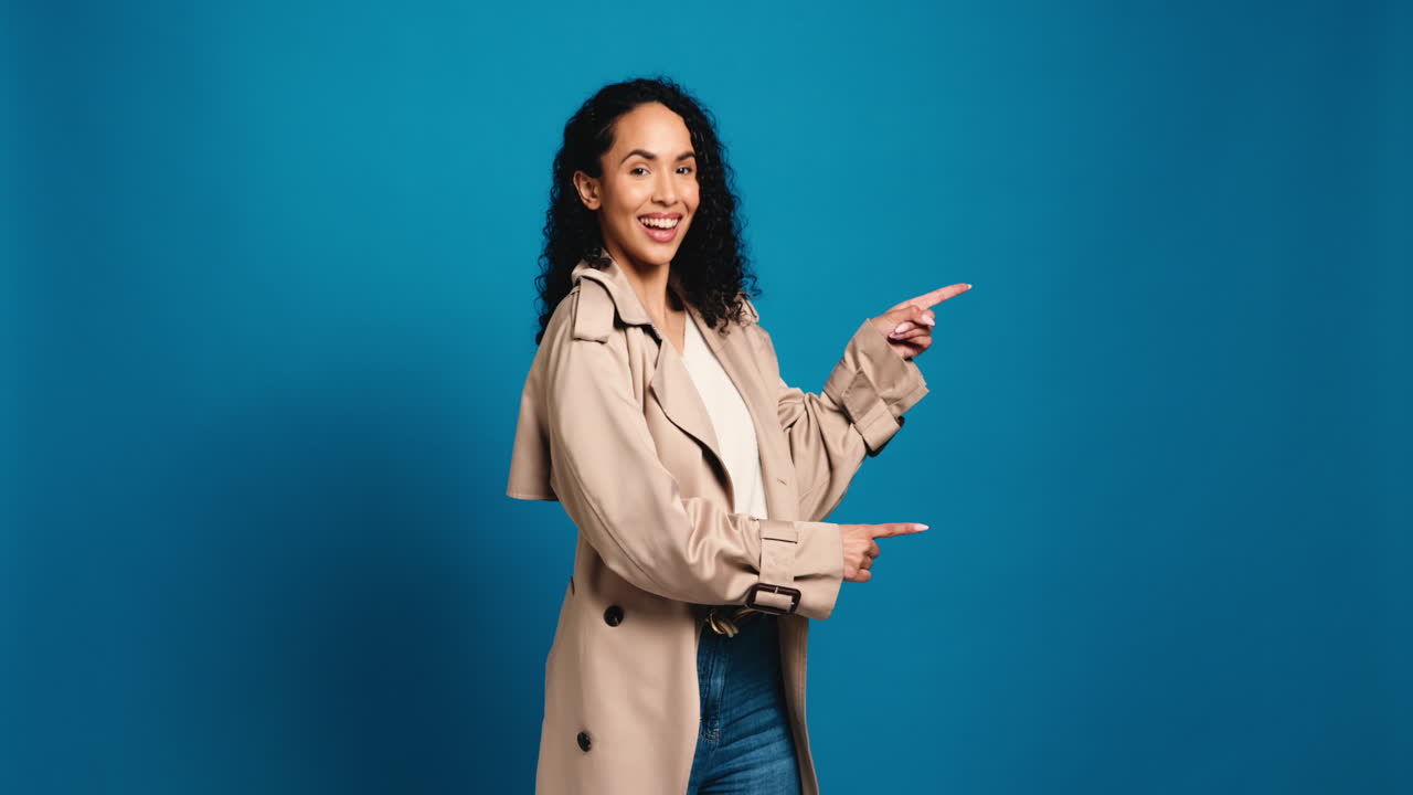 Woman in trench coat pointing