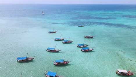 boats on reef of kwale island of zanzibar in the indian ocean, aerial