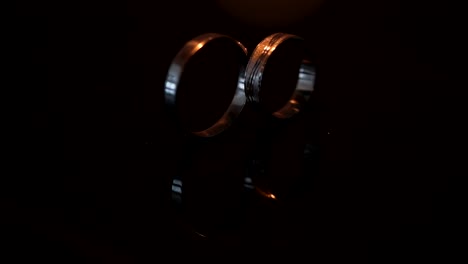 wedding rings on the table with sparkles