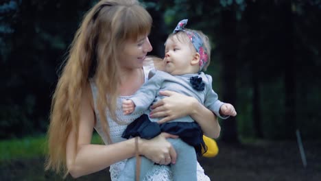 Young-girl-is-playing-with-a-young-baby