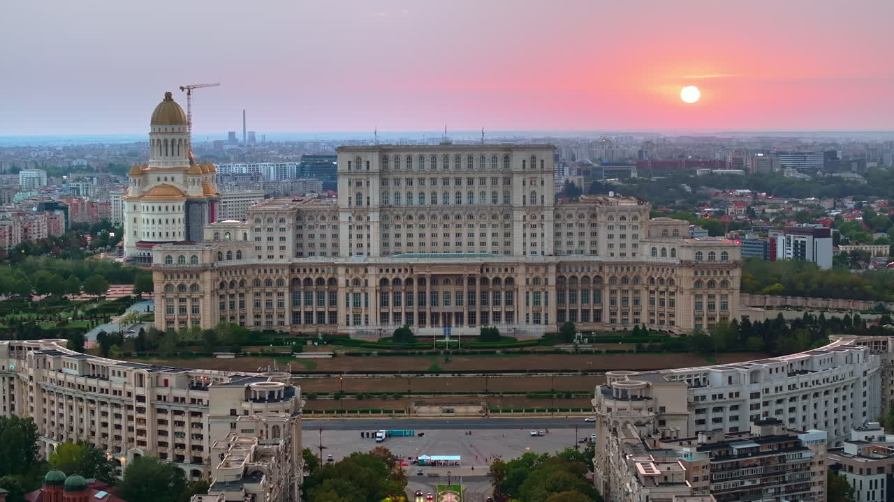 Aerial drone view of the Palace of Parliament in Bucharest, Romania at sunset