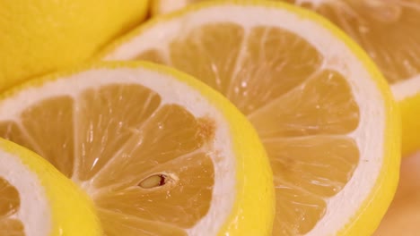 detailed view of vibrant lemon slices arranged closely together, showcasing their juicy texture and bright yellow color.