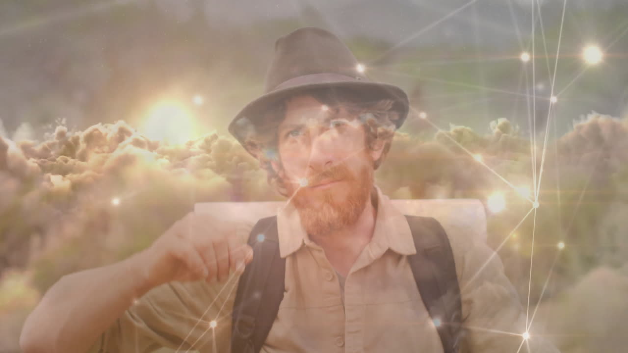 man tipping fedora hat outdoors, showcasing technology cloud overlay and glowing network lines