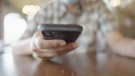 a young businessman is taking a video conference with customers via a smart phone connected to the internet.