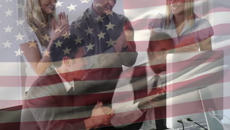 animation of american flag waving over multi ethic businessmen and businesswomen