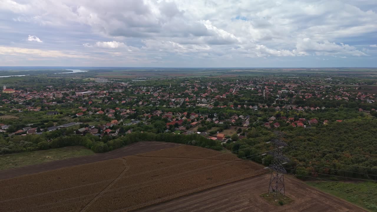 Orbital aerial view of the traditional townscape of Ercsi with the Danube River in the background in Hungary