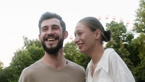 young couple kissing at the park