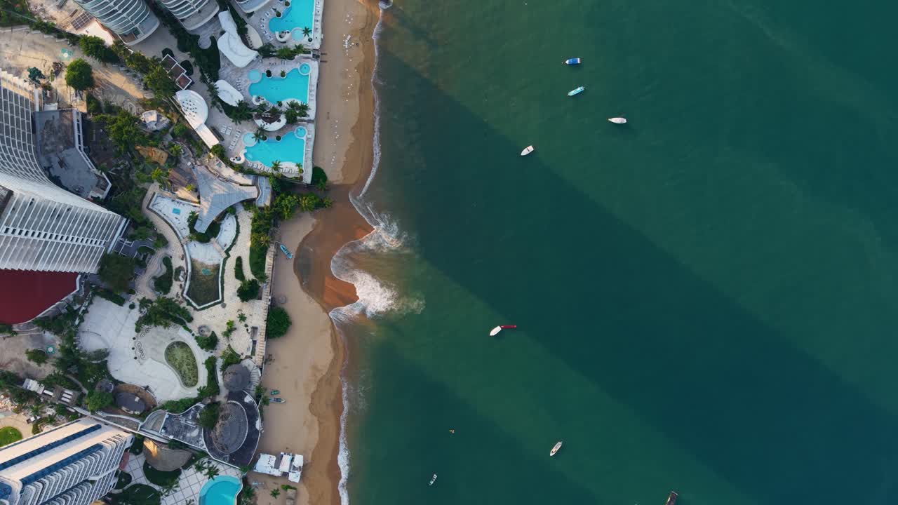 Aerial top-down shot of Acapulco’s turquoise beach, Mexico