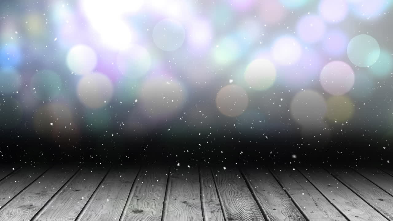 Animation of snow falling over glowing spots of light with copy space and wooden surface