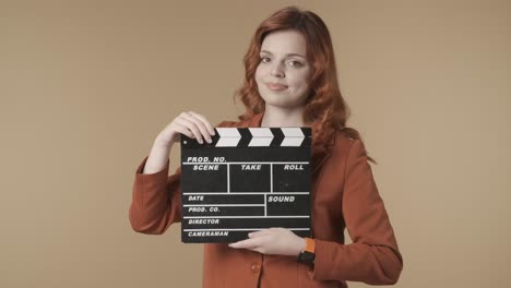 woman holding clapperboard