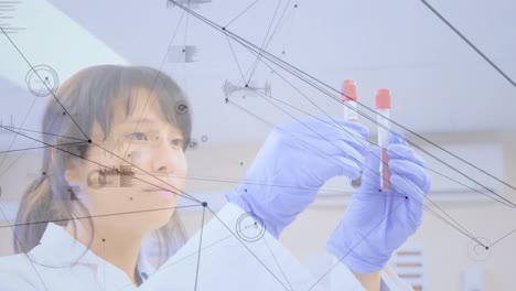 Animation-of-network-of-connections-over-asian-female-lab-worker-with-samples