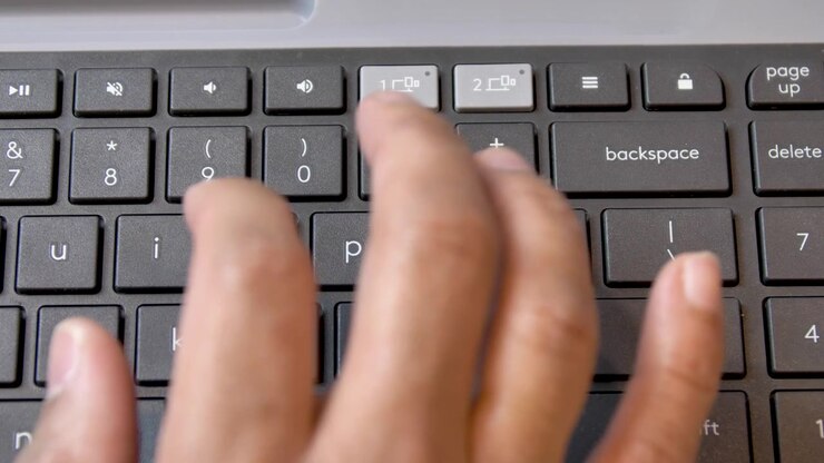 Man typing and pressing backspace on the keyboard