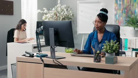 busy afternoon at the office, accounting department, marketing, two elegant women work in front of computers, create documents, plan strategy, enter bills into the system