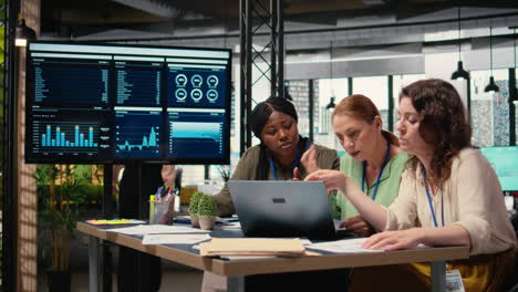 vertical video confident powerful women gathering in the boardroom to evaluate data reports