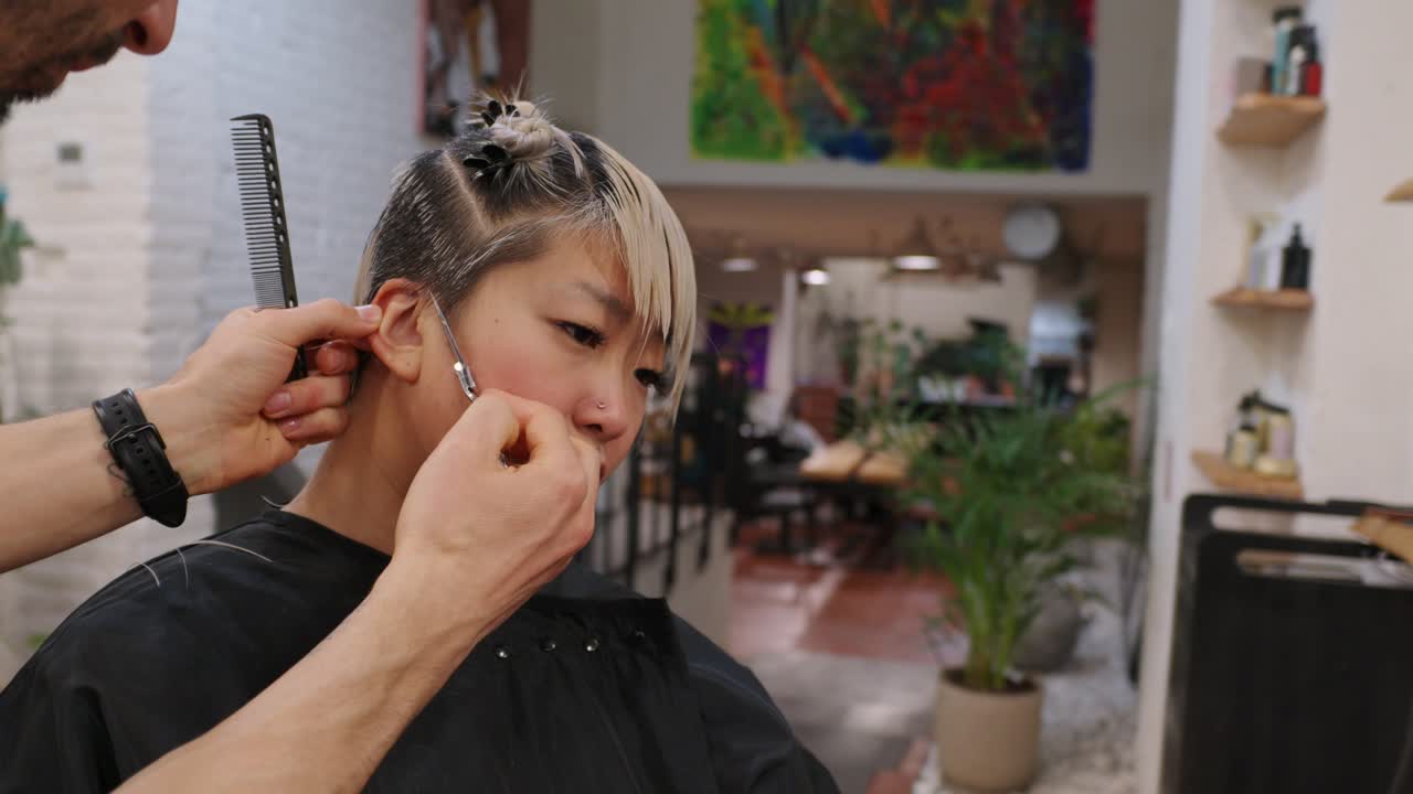 Woman getting a haircut at a hair salon
