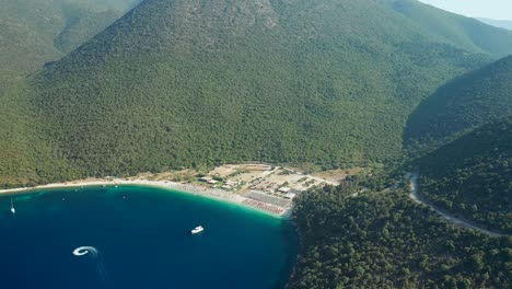 High-flying-view-Beautiful-Antisamos-beach-surrounded-by-vegetation,-Kefalonia-Island