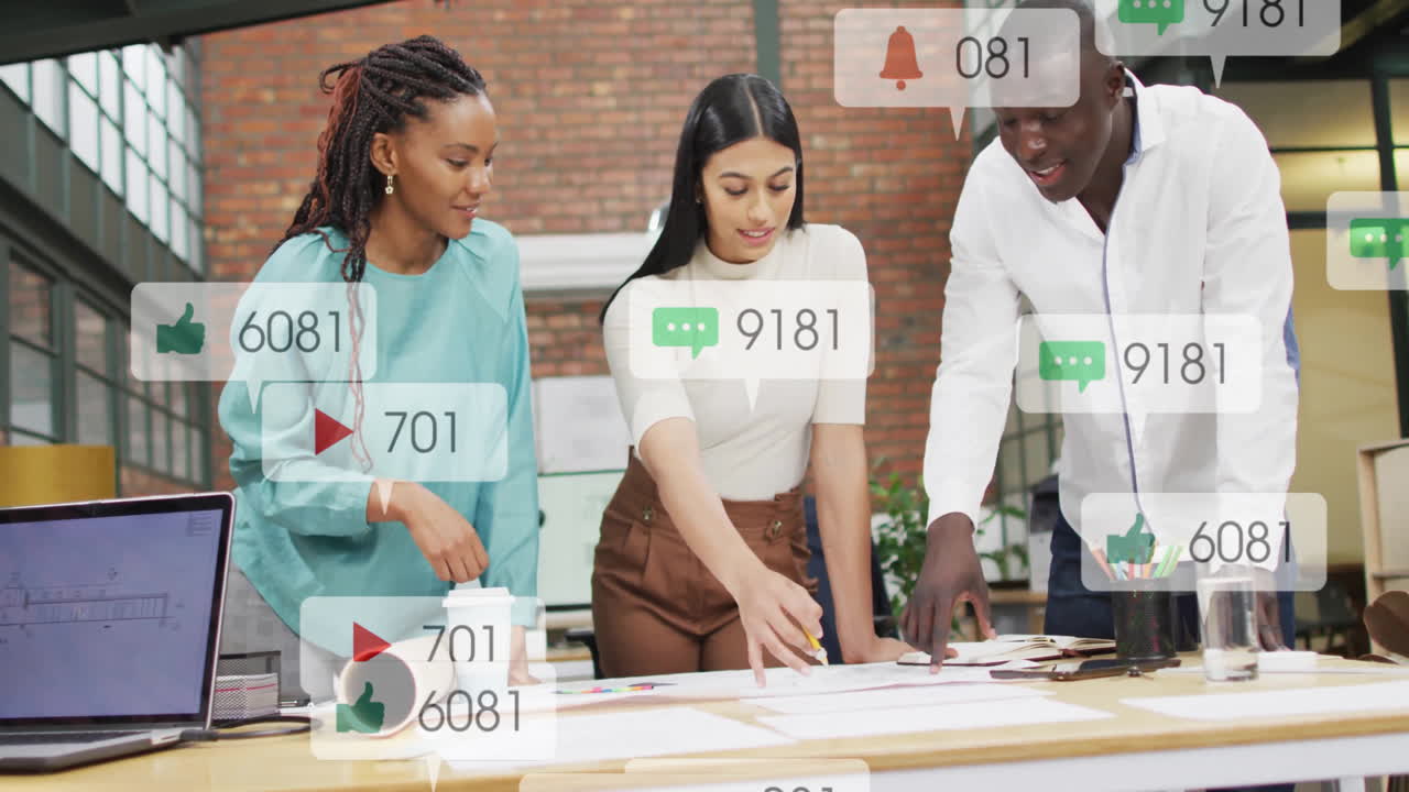 Animation of numbers, icons in notification bars, diverse coworkers discussing blueprint in office