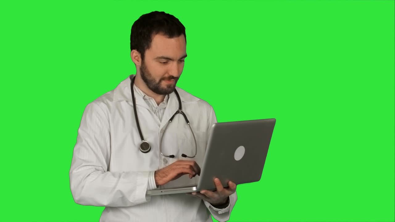 Medical doctor working with laptop on a Green Screen, Chroma Key