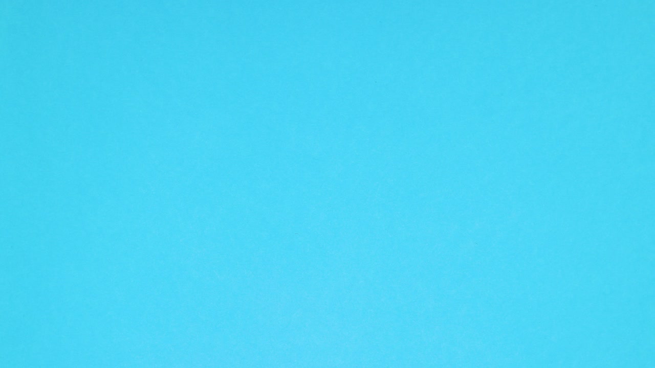 Rolled ten euro banknote appear and unroll on blue background - Stop motion