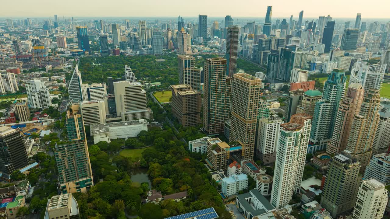 Aerial view of Ploenchit junction with cars traffic skyscraper buildings. Bangkok City in downtown at night, Thailand