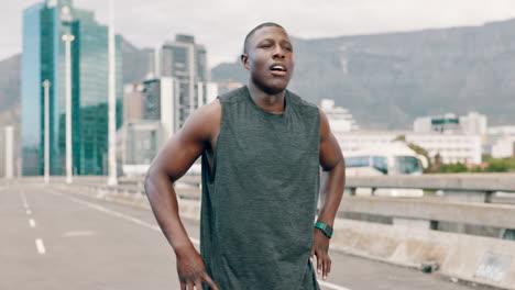 man taking a break after running