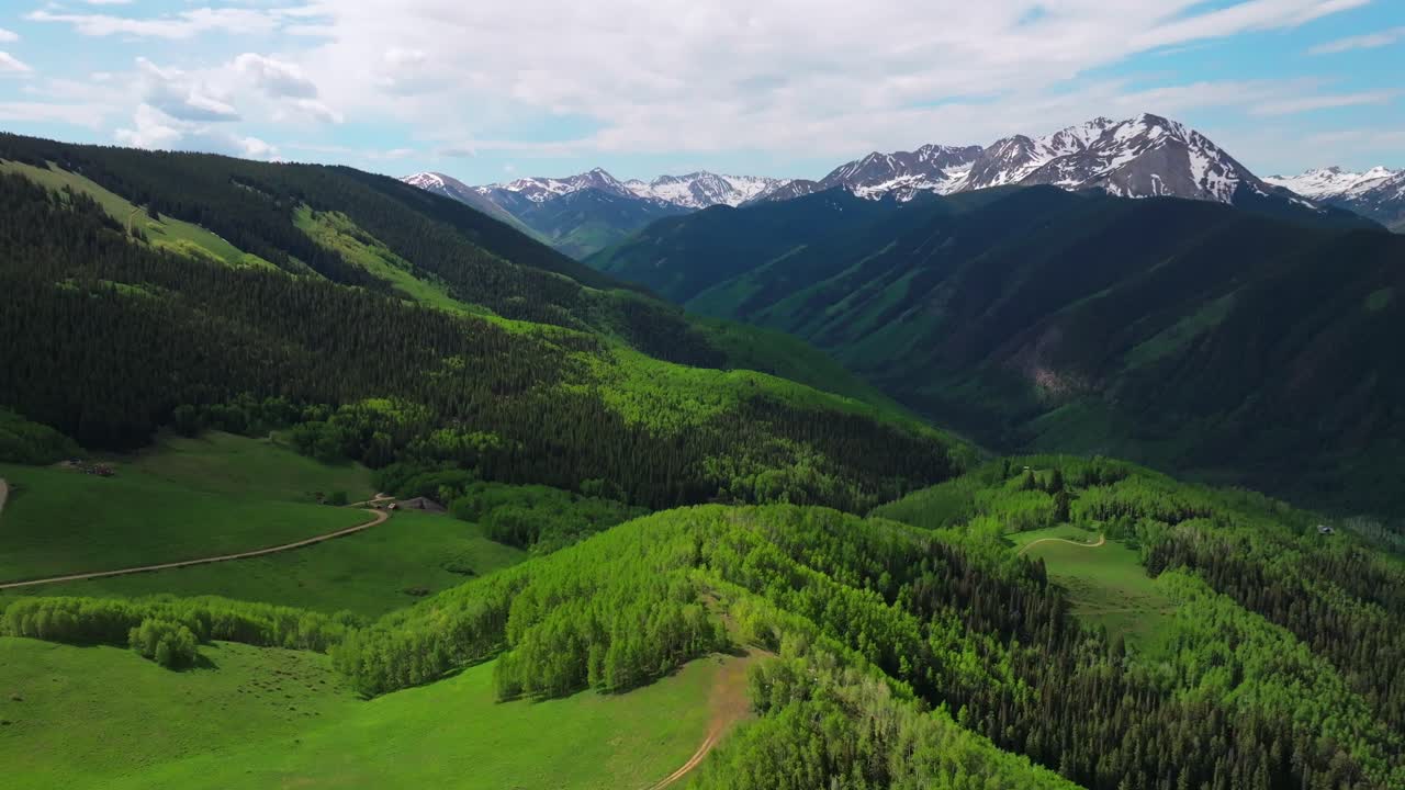 AJAX Aspen Mountain backcountry spring summer Rocky Mountain Conundrum Creek Castle Peak aerial drone Ashcroft Little Annie Trail Basin 4wd road morning blue sky cabins Aspen trees grove circle right