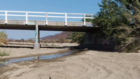 bridge over drying river during drought