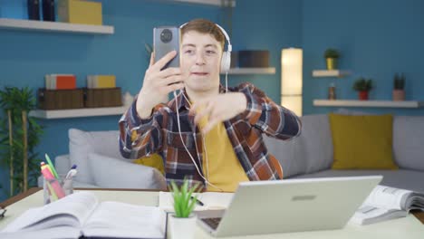 student dancing to the music on the phone.