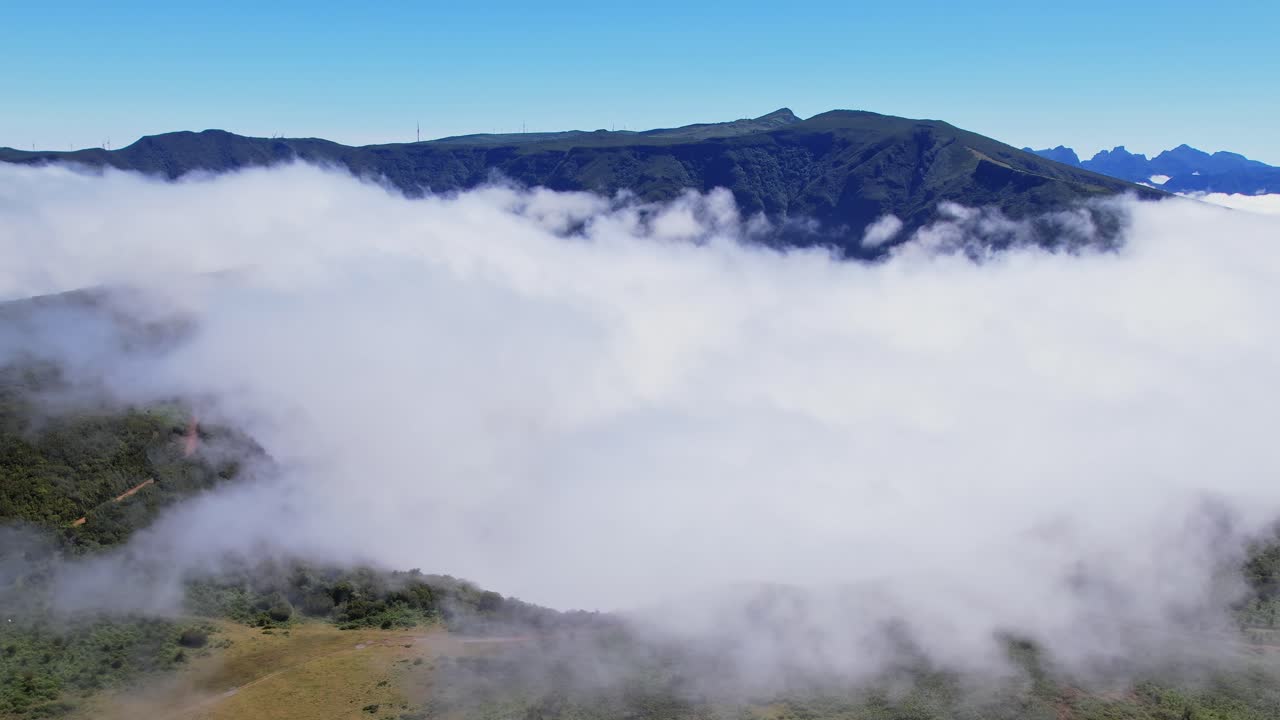 Drone view of fog covering mountains in Madeira, Portugal