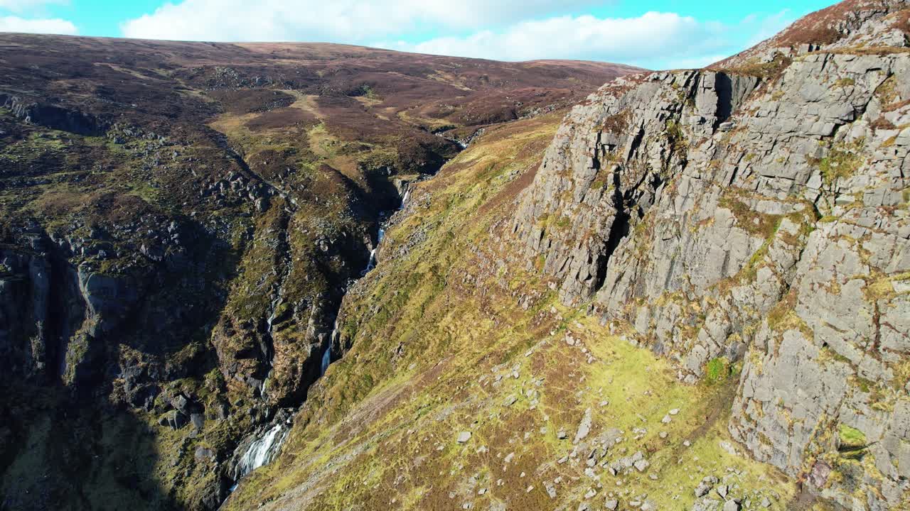 Irish Mountains drone flying along steep Cliff to The Dramatic Mahon Falls Comeragh Mountains Waterford Ireland epic Locations and Landscapes