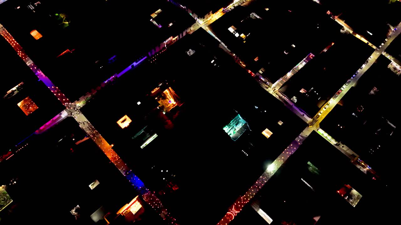 Top down aerial view of the illuminated streets and central square of salamina, caldas in colombia