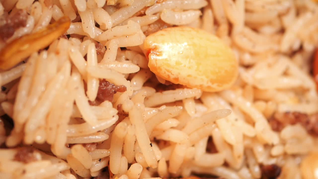 Closeup of a delicious Middle Eastern rice dish with meat and nuts