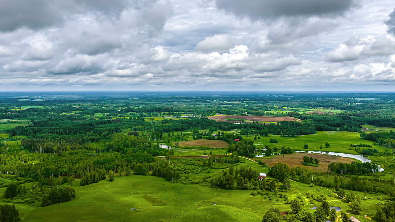Lush green countryside timelapse with rolling clouds above
