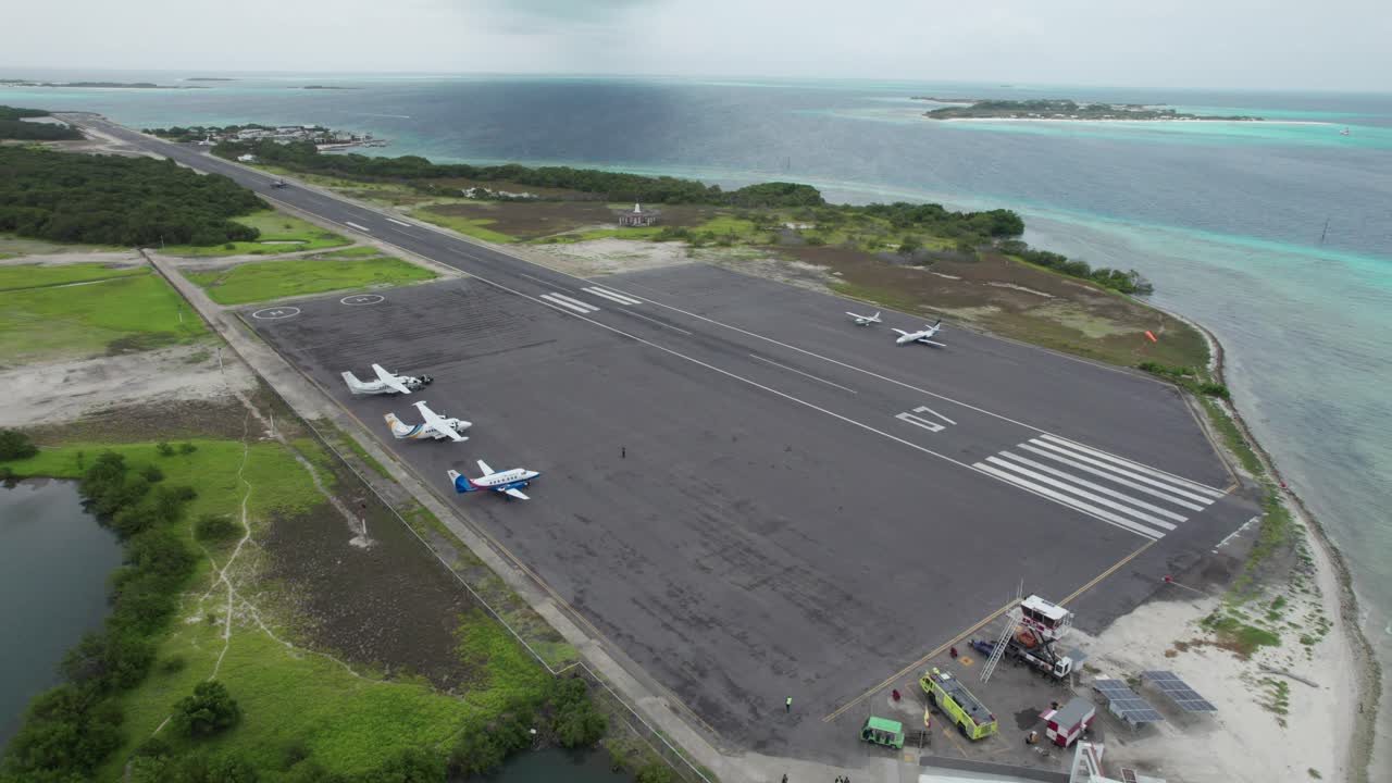 Aerial view of Los Roques airport landing strip with planes