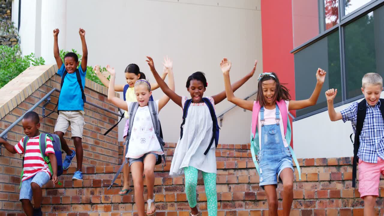 Group of kids getting down from staircase