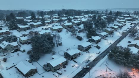 Snow-flurries-in-American-hilly-neighborhood-covered-in-snow-at-dawn