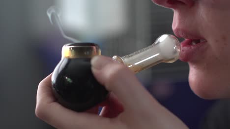 Close-Up-Of-Girl-With-A-Smoking-Pipe-Tobacco