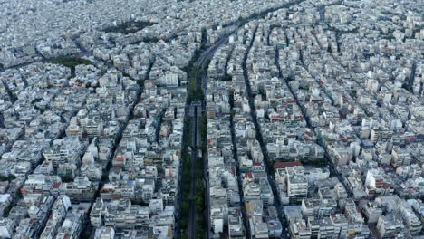 drone aerial shot over athens, following road through the city, greece