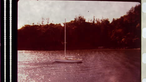 old celluloid film footage of small sailing boat